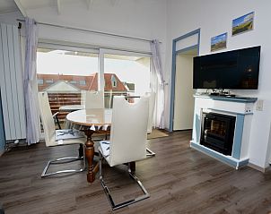 Modern dining room in Motel Texel - Apartment 315/1T, De Koog, Texel with large windows and lots of natural light.