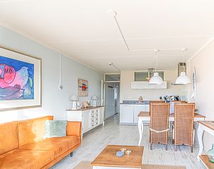 Bright and modern living space in Apartment Juliana 148 Island and Sea View, De Koog, Texel with art on the wall.