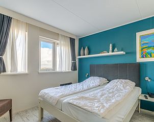 Comfortable bedroom in Apartment Juliana 148 Island and Sea View, De Koog, Texel with double bed and art.