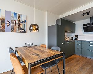 Modern kitchen and dining area in Apartment Juliana 172 Eilandzicht, De Koog Texel, ideal for a vacation on the Wadden Islands.