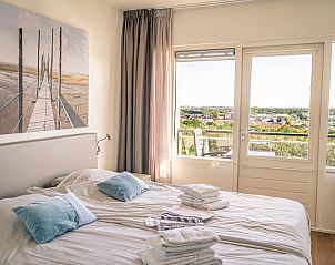 Bright bedroom with views of nature in Apartment Juliana 172 Eilandzicht, De Koog Texel, in the Wadden Islands.