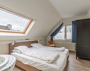 Attractive bedroom in Holiday home Kamperfoelie 43 with sauna, De Koog, Texel, with skylight for natural light.
