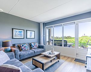 Apartment Juliana 042 in De Koog, Texel, offers a comfortable seating area with views of the Wadden Islands.