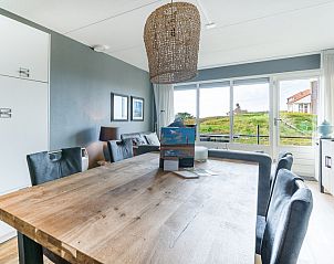 Dining area overlooking nature in Apartment Juliana 042, De Koog, Texel, perfect for family dinners.
