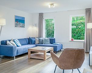 Cozy living room in Holiday home Kamperfoelie 37 De Koog Texel with comfortable seating area.