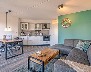 Cozy living room in Apartment Zeedistel 20 in De Koog, Texel with modern kitchen and comfortable seating area.