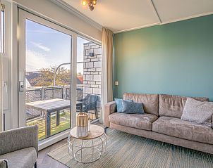 Cozy living room overlooking terrace in Apartment Zeedistel 24, De Koog, Texel.