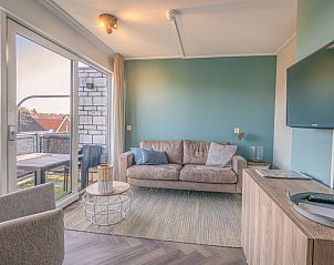 Cozy sitting area with terrace view in Apartment Zeedistel 24, De Koog, Texel.