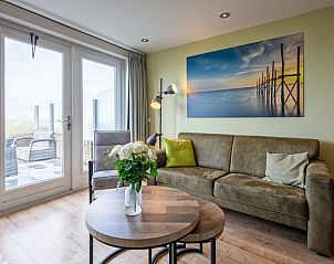 Stylish sitting area in Apartment - 4-bed (1535), De Koog, Texel with access to the sunny terrace.