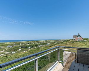 Balcony of Apartment Juliana 168 Zeezicht, De Koog Texel, with breathtaking views of sea and nature.