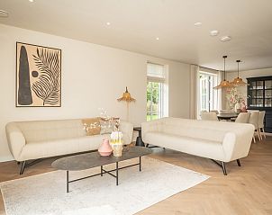 Cozy living room of Villa 25a in De Koog Texel, modern furnished vacation home on the Wadden Islands.