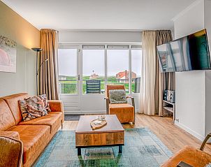 Cozy living room in Apartment Juliana 136 Island and Sea View, De Koog, Texel with a view of nature.