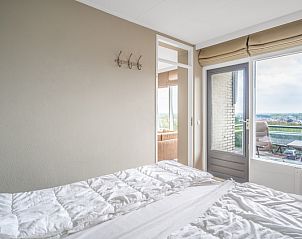 Bedroom with balcony and view in Apartment Juliana 178 Eilandzicht, De Koog, Texel.