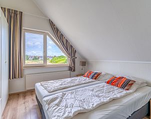 Bright bedroom in Holiday home Honeysuckle 69 with sauna, De Koog, Texel, with ample storage.