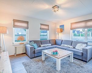 Cozy living room of Holiday home Kamperfoelie 87 in De Koog Texel with comfortable seating area.