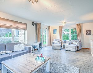 Bright living space in Holiday home Honeysuckle 87, De Koog Texel overlooking the garden.