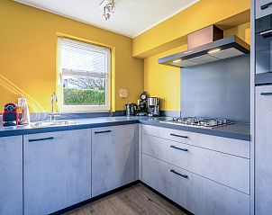Modern kitchen in Holiday home Honeysuckle 87, De Koog Texel with sleek decor.