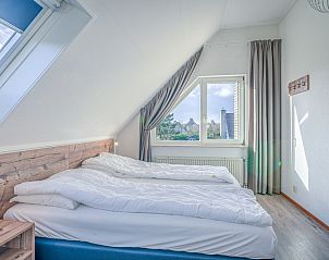 Bedroom in Holiday home Kamperfoelie 87, De Koog Texel with comfortable double bed and view.