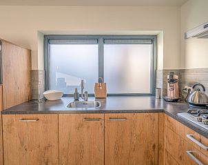 Modern kitchen in vacation home Het Bospad - Brink 15, De Koog, Texel. Fully equipped for a comfortable stay.