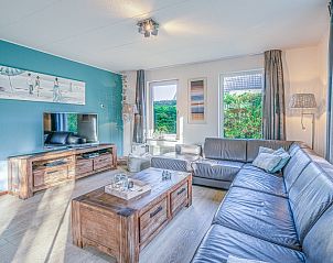 Cozy living room in Holiday Home Honeysuckle 31, De Koog, Texel, with comfortable seating area and modern interior.