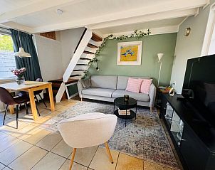 Cozy living room in Texel C vacation home, De Koog, Texel, with modern decor and lots of natural light.