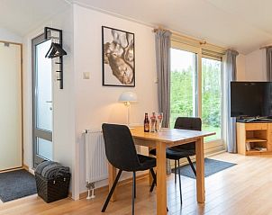 Dining area in Holiday home in De Koog with garden view, Texel, Wadden Islands.