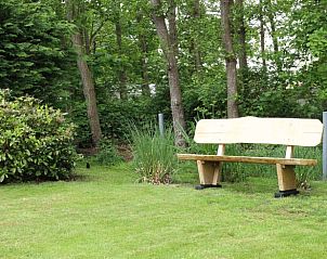 Wooden bench in the garden of Holiday home in De Koog, perfect for relaxation, Texel, Wadden Islands.