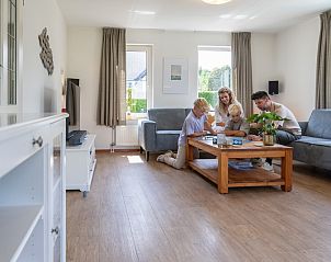 Cozy gathering in the living room of Holiday Home Honeysuckle 75, De Koog, Texel.