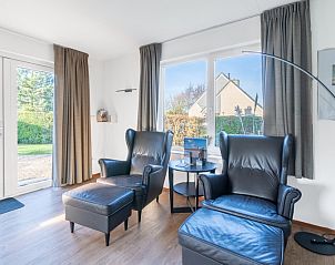 Stylish reading corner in Holiday home Honeysuckle 75, De Koog, Texel overlooking the garden.