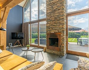 Cozy sitting area with fireplace in Villa 181 with Hot tub, De Koog Texel.