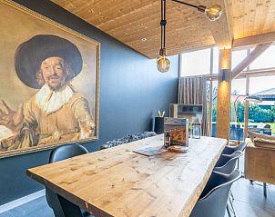 Dining room with art on the wall in Villa 181 with Hot tub, De Koog Texel.