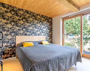 Bedroom with luxury bed in Villa 181 with Hot tub, De Koog Texel, overlooking nature.