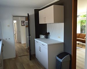 Modern kitchen in Plevierstraat 24 - Tuunwoal vacation home, De Koog, Texel with sleek finish.