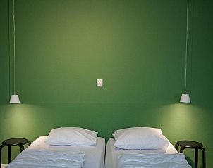 Comfortable bedroom in Apartment 2 persons, De Koog, Texel with green accents.