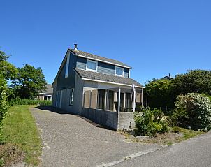 Vacation home Stappeland 163 in De Koog, Texel, offers a charming exterior with an inviting veranda.