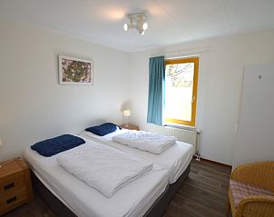 Bedroom in Holiday home Stappeland 163, De Koog, Texel, with comfortable beds and serene furnishings for a good night's sleep.