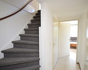Stairs and hallway in Holiday home Stappeland 163, De Koog, Texel, lead to the cozy upstairs living spaces.