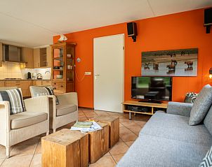 Cozy sitting room in Villa 6 persons with 2 bathrooms, De Koog, Texel. Vacation home with colorful furnishings.