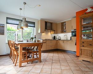 Dining area and kitchen in Villa 6 persons with 2 bathrooms, De Koog, Texel. Cozy vacation home on the Wadden Islands.