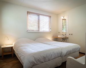 Bedroom with two beds in Villa 6 persons with 2 bathrooms, De Koog, Texel. Comfortable vacation home on the Wadden Islands.