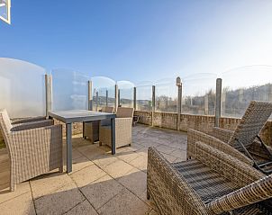 Private terrace of Resort De Buteriggel - Apartment 9, De Koog, Texel with seating and views of the dunes.