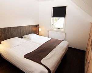Schlafzimmer in Stappeland - De Duinvlinder, Ferienhaus in De Koog, Texel mit Doppelbett und entspannender Atmosphre.