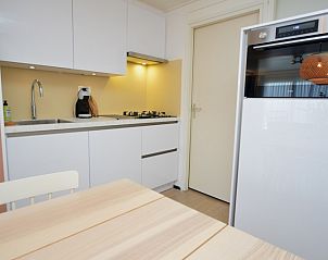 Modern kitchen in Apartments Anna - Sun, De Koog, Texel, with sleek finish and all necessary appliances.
