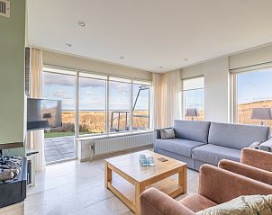 Enjoy a comfortable sitting area with sea view in Apartment Juliana 066 Sea View on Texel, Wadden Islands.