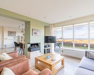 Spacious living room with modern furnishings and views of nature at Apartment Juliana 066 Zeezicht, De Koog, Texel.