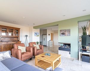 Cozy indoor area with fireplace in Apartment Juliana 066 Sea View, ideal for relaxation on Texel.