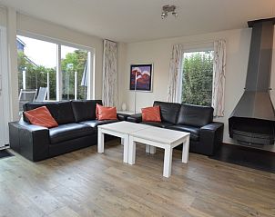 Cozy living room of Holiday home Stappeland 76 in De Koog, Texel with comfortable seating area.