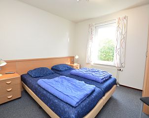 Bedroom in Holiday home Stappeland 76, De Koog, Texel with comfortable double bed.