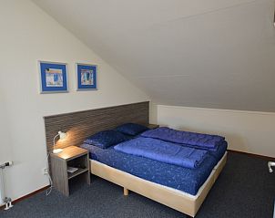 Cozy bedroom under sloping roof in Holiday home Stappeland 76, De Koog, Texel.