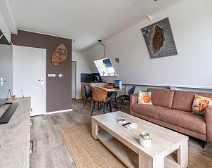 Spacious living room and dining area in Apartment Anna 222, De Koog, Texel, ideal for a relaxing vacation on the Wadden Islands.